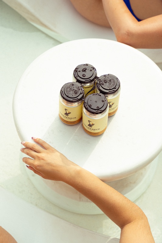 Coffee cans on a white pedestal