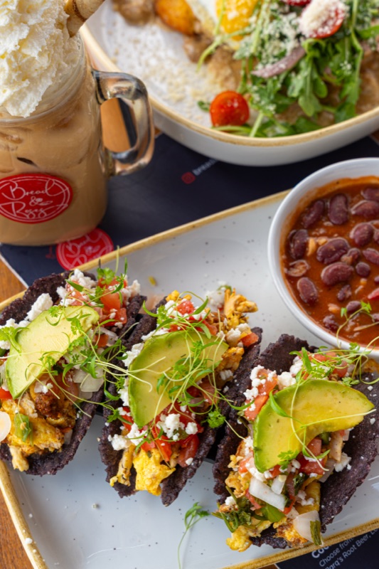 Tacos with avocado, beans and an iced latte